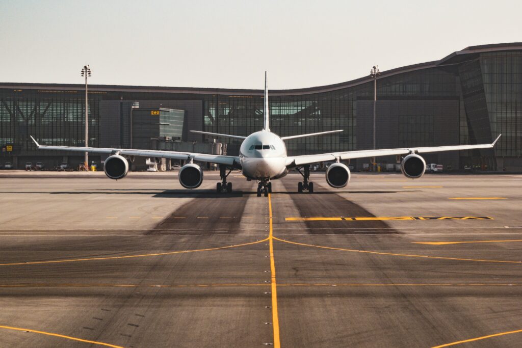 Grounded commercial aircraft on the tarmac at dusk during an aircraft on ground situation