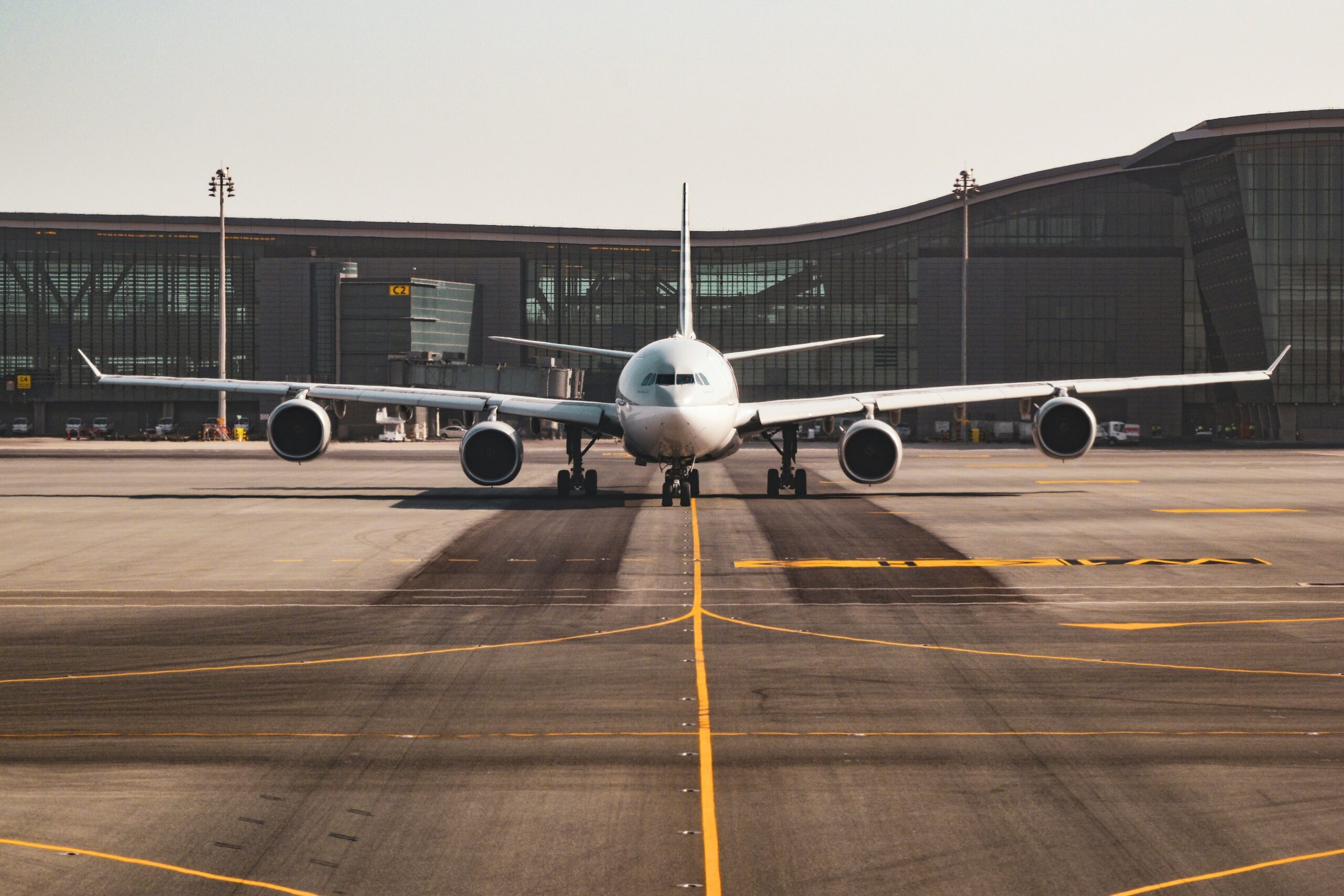 Grounded commercial aircraft on the tarmac at dusk during an aircraft on ground situation