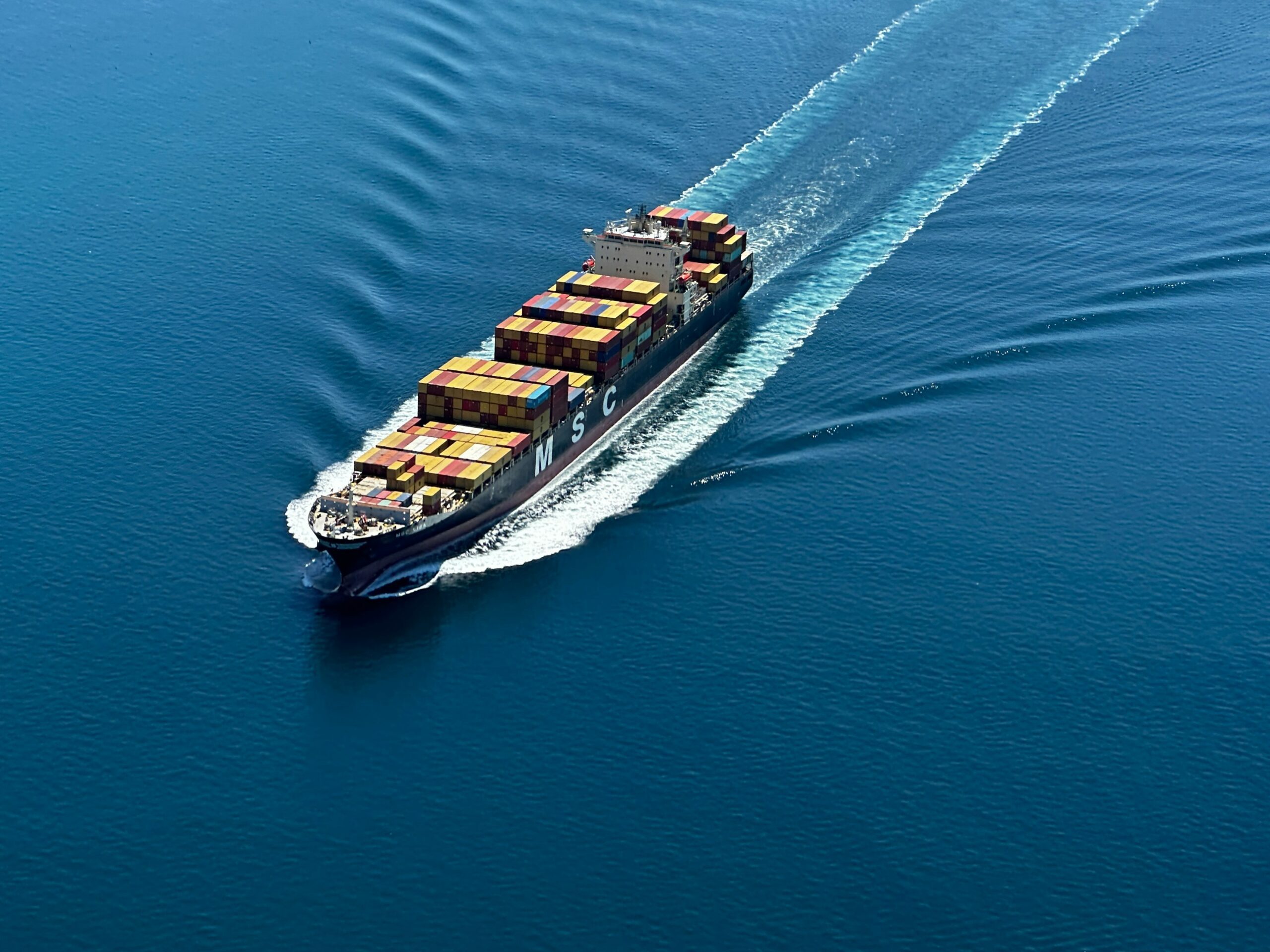 ship spares logistics Onboard courier delivering an urgent spare part to a vessel at the dock